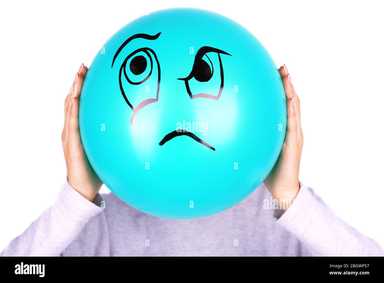 Woman holding balloon in front of her face Stock Photo - Alamy