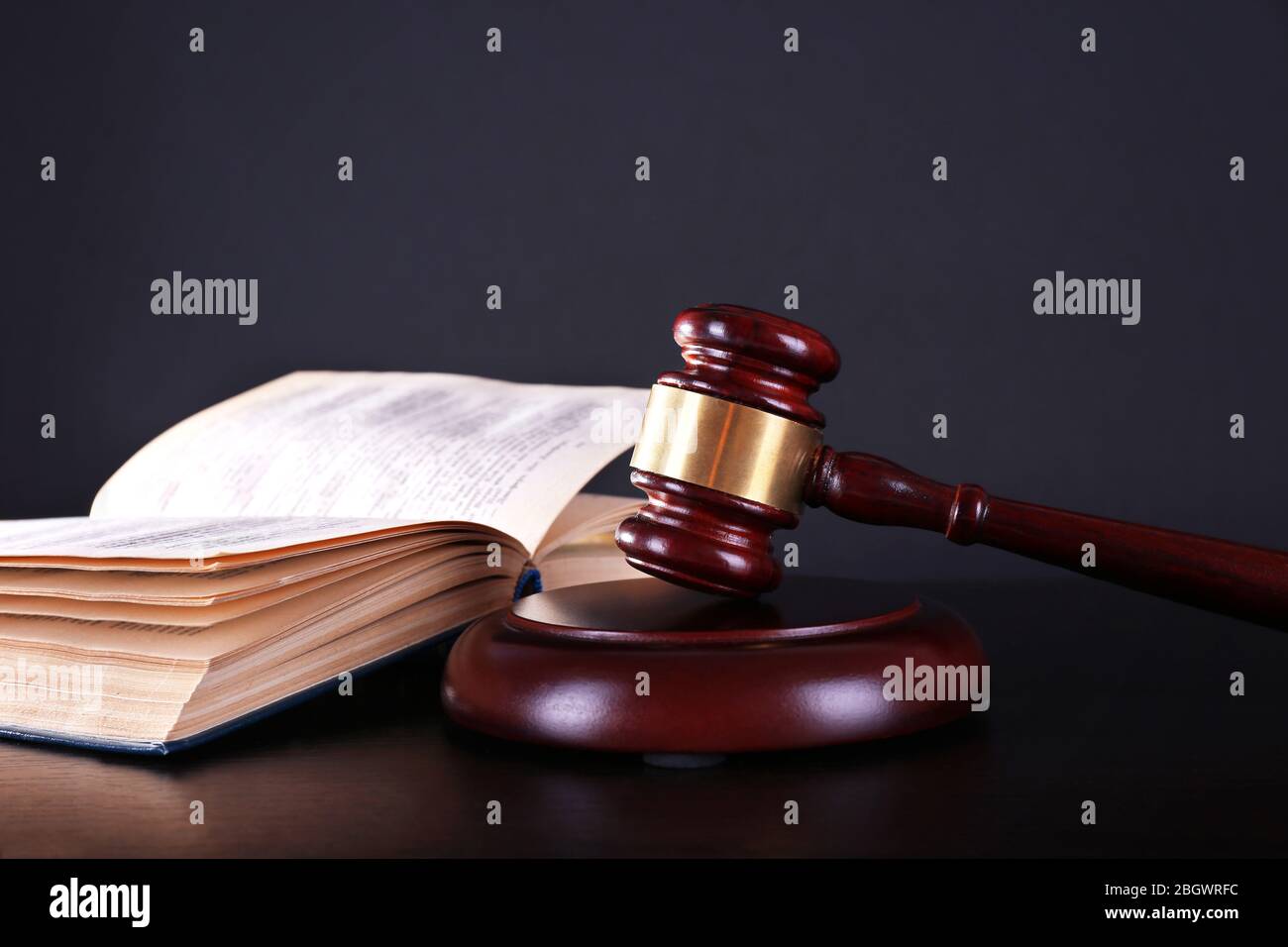 Judge's gavel and open book on dark grey background Stock Photo - Alamy