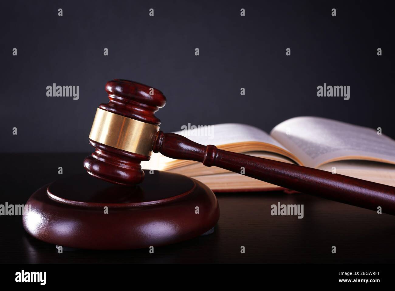 Judge's gavel and open book on dark grey background Stock Photo - Alamy