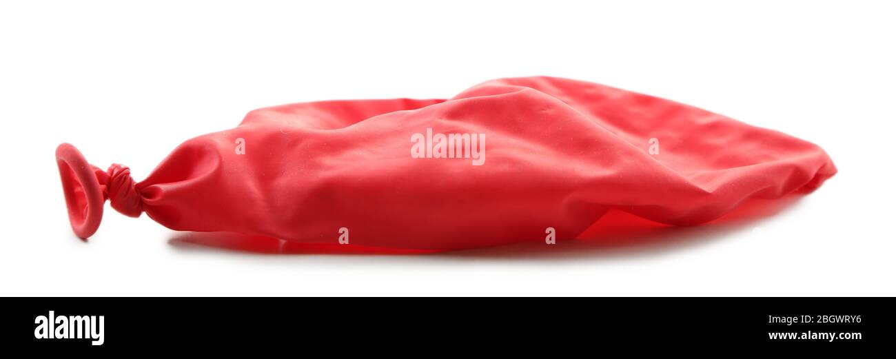Popped red balloon isolated on white Stock Photo - Alamy