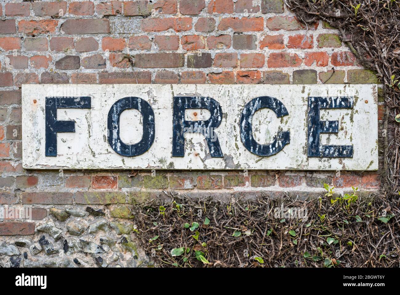Forge sign on old brick and flint building. April, 2020 Stock Photo