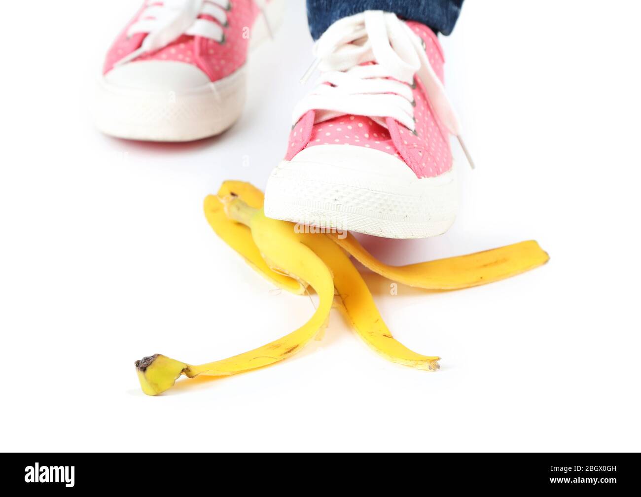 Shoe to slip on banana peel and have an accident, isolated on white ...