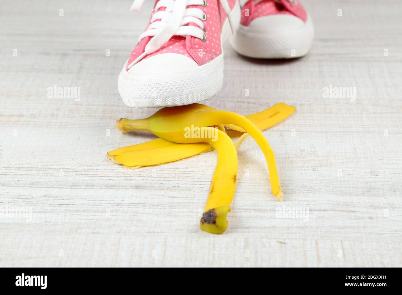 Shoe to slip on banana peel and have an accident Stock Photo - Alamy