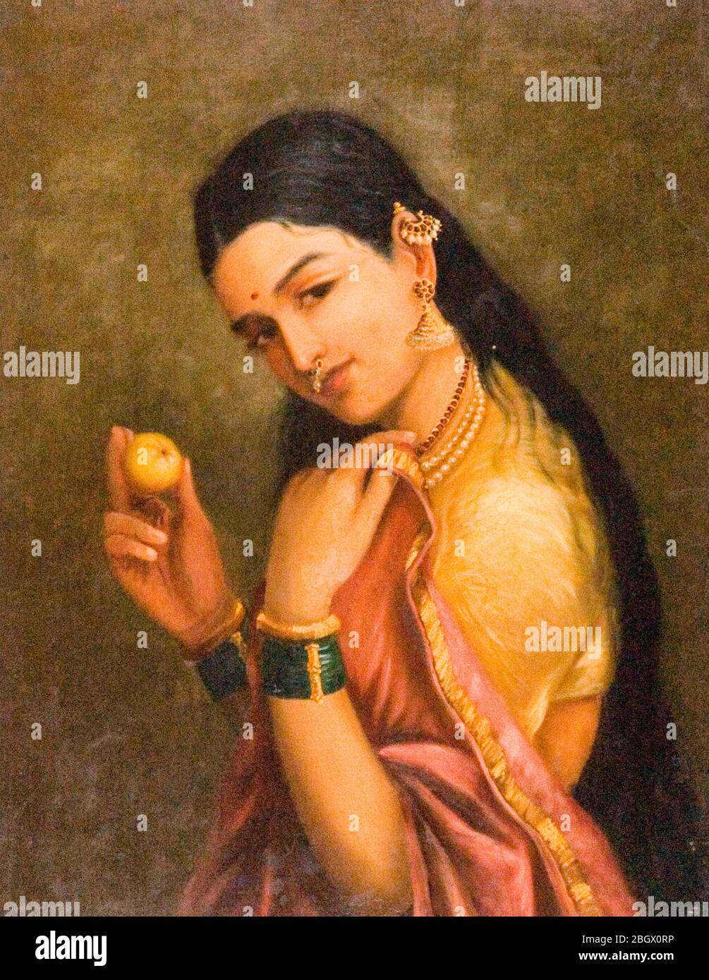 Woman Holding a Fruit - Raja Ravi Varma Stock Photo