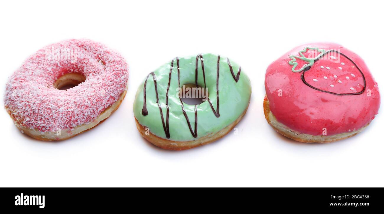 Delicious donuts with color glaze isolated on white Stock Photo - Alamy