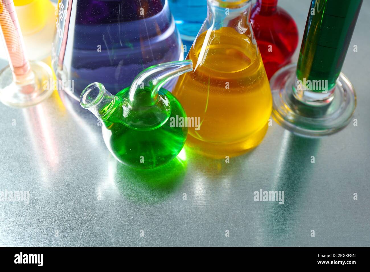 two liquid polymers in measuring cups added together gives chemical a  reaction Stock Photo - Alamy