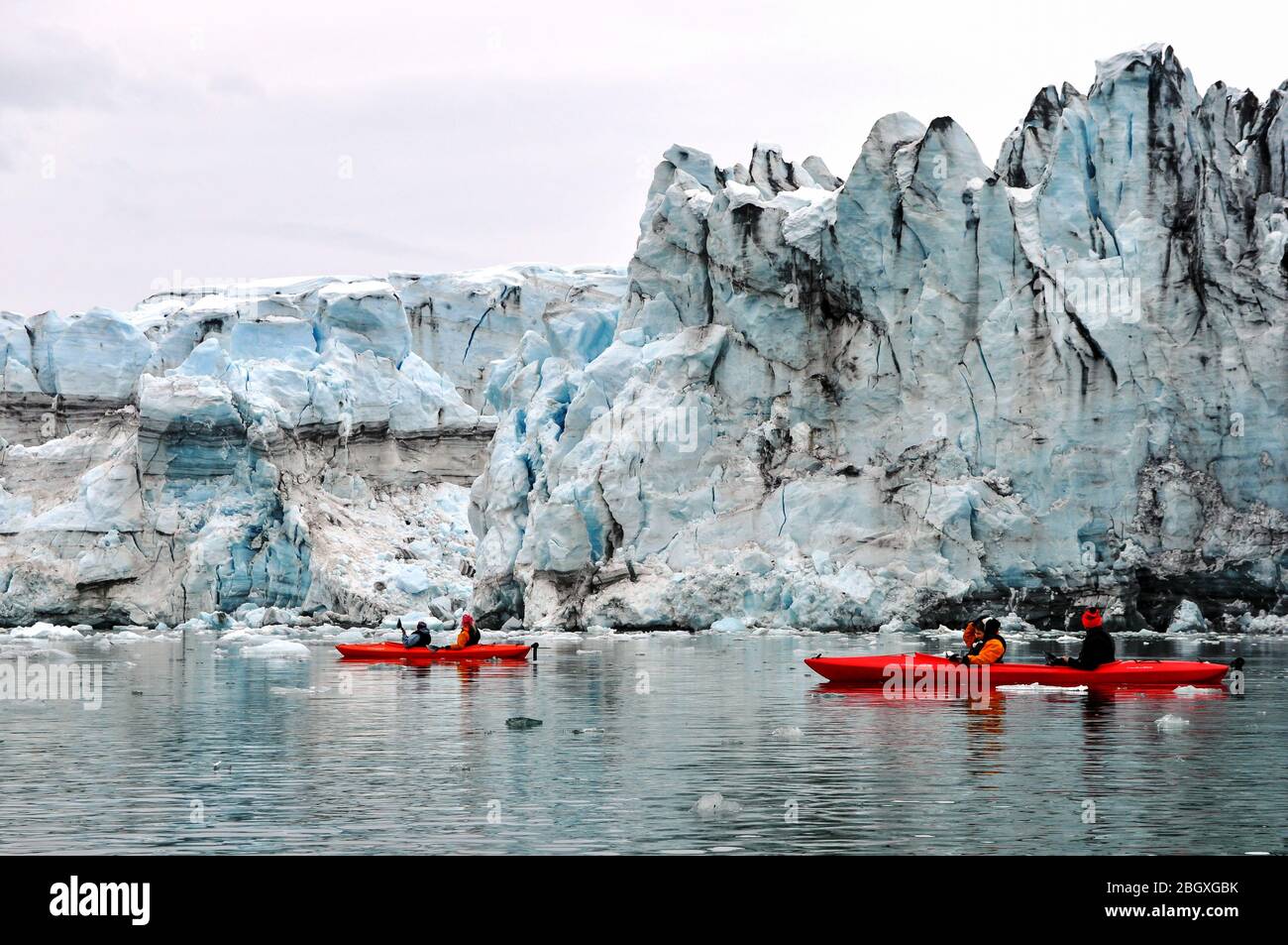 Kayaking in front of Lamplugh Glacier in Glacier Bay, Alaska Stock Photo