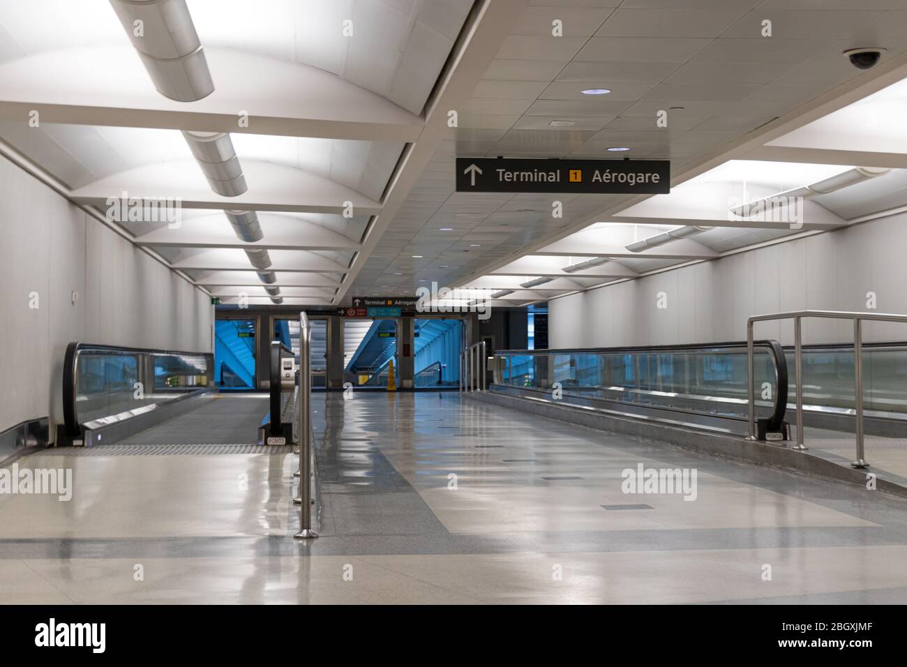 Ghost town like scene inside a tunnel at Toronto Pearson Intl. Airport going towards Terminal 1 during the COVID-19 pandemic. Stock Photo