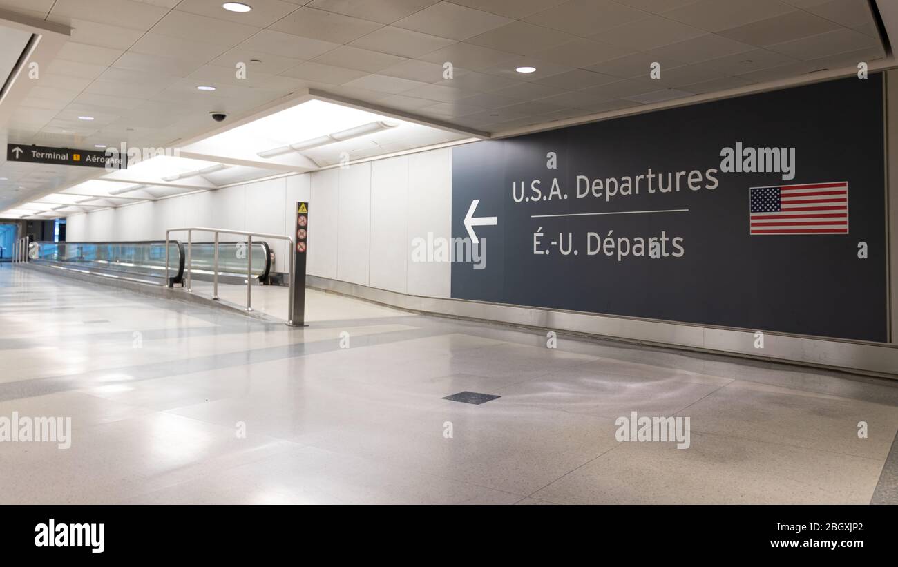 U.S.A. Departures sign at Toronto Pearson, Terminal 1 seen empty during the global pandemic of COVID-19, a novel Coronavirus. Stock Photo
