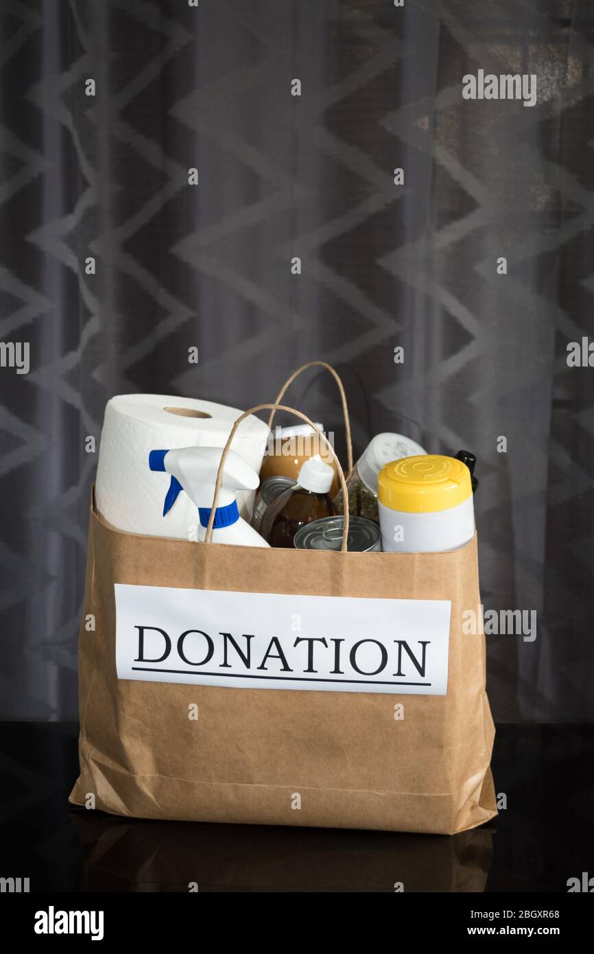 A full donation bag with food and cleaning supplies packed and ready to be handed out to people in need during the Covid-19 / Coronavirus Pandemic Stock Photo