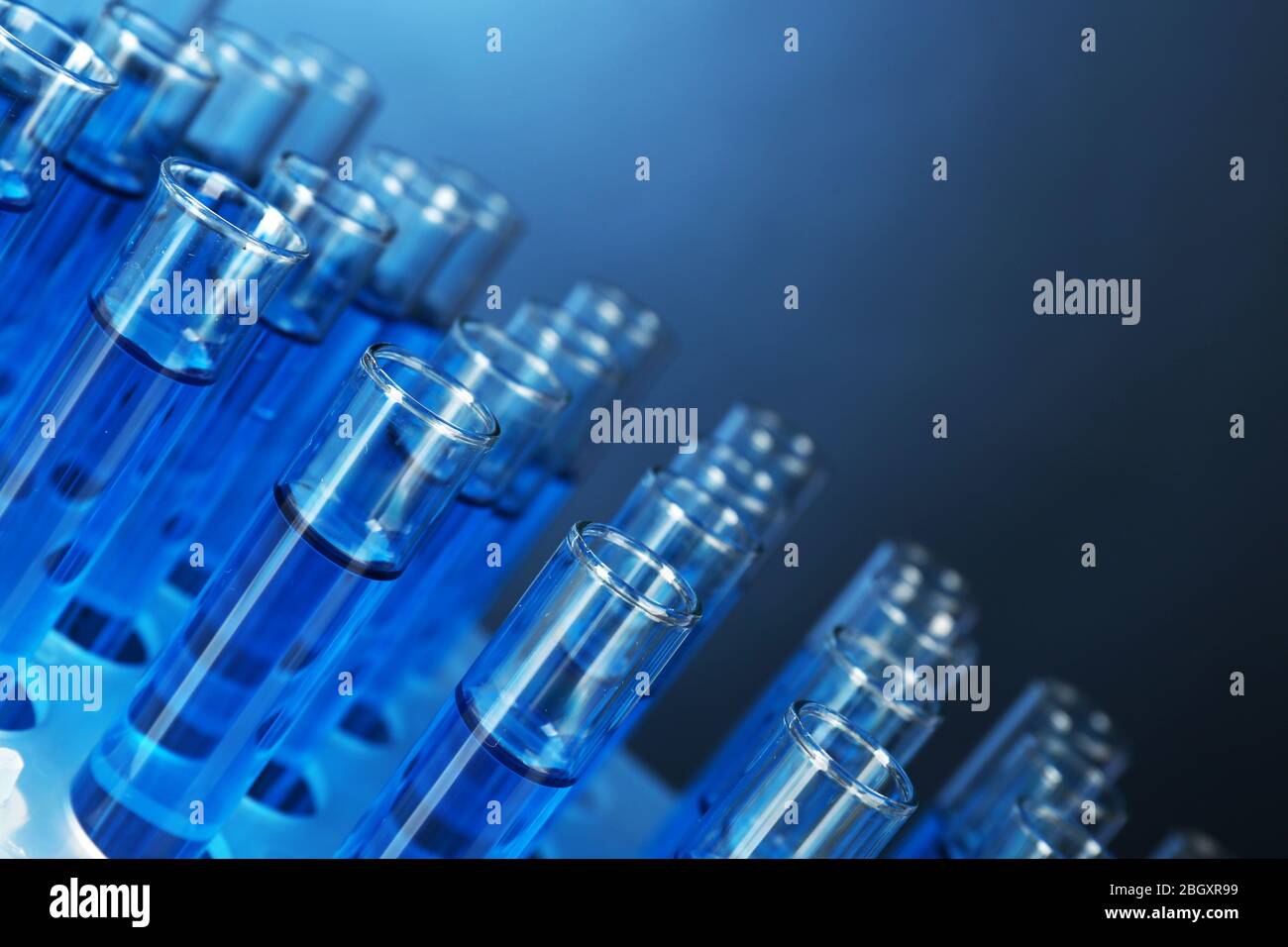 Blue water in a transparent test-tube on dark background Stock Photo ...