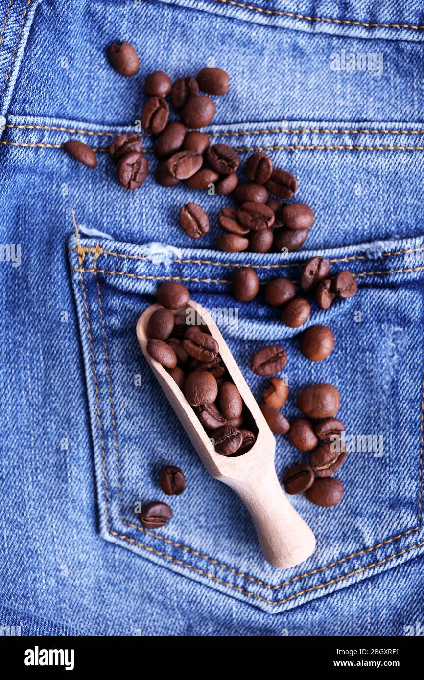 Scoop of coffee beans on the jeans background Stock Photo Alamy