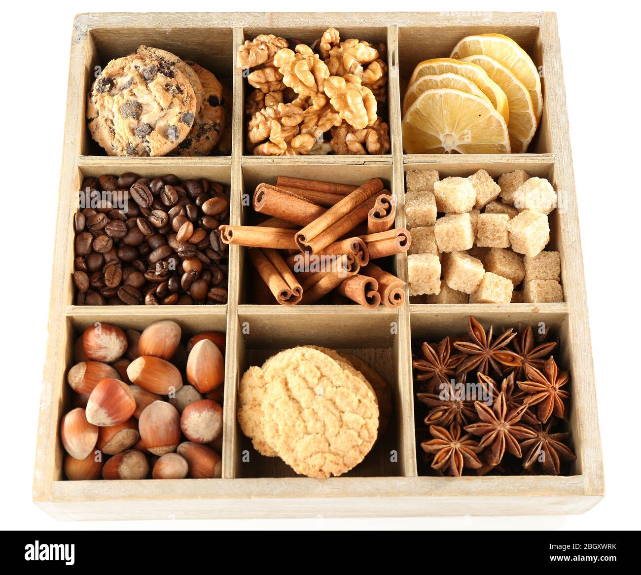 Square box with cookies, nuts and spices isolated on white Stock Photo