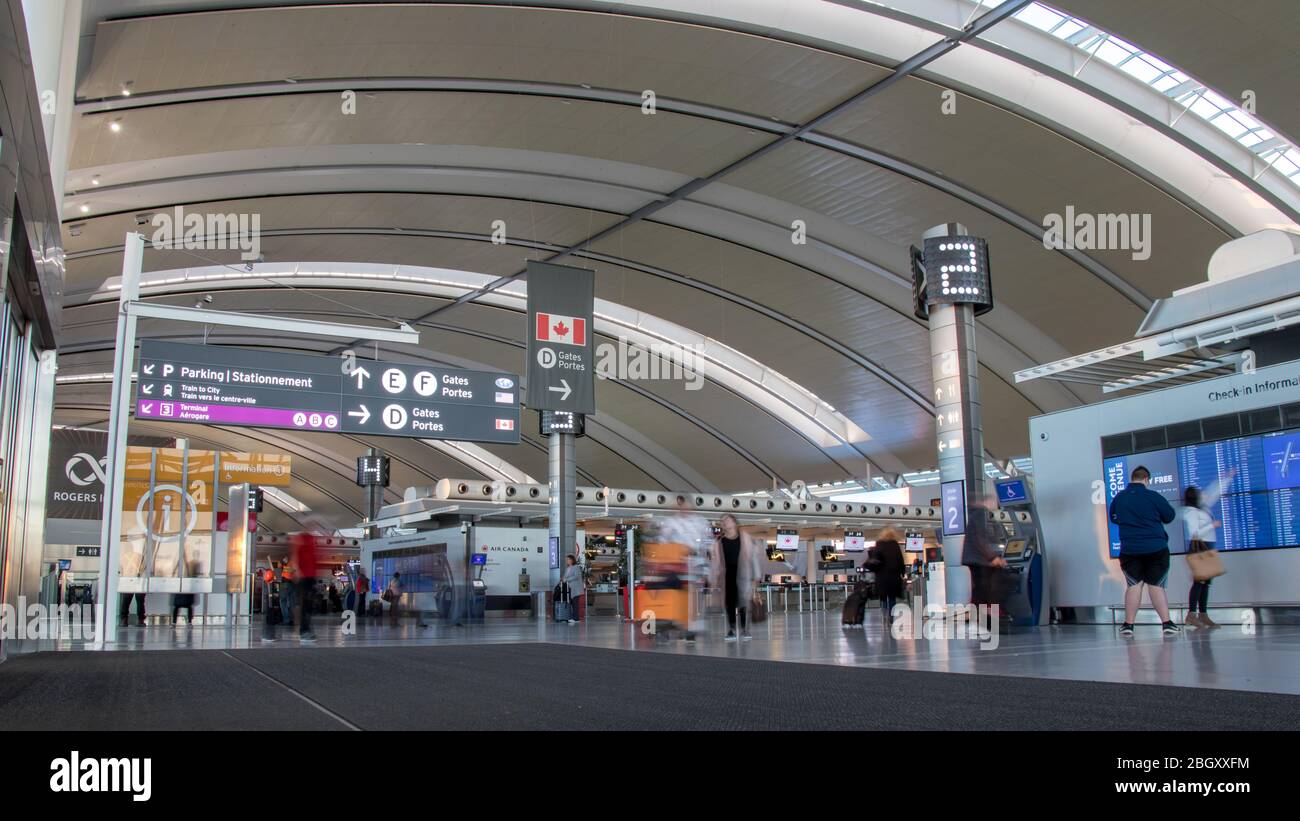 Inside Toronto Pearson Intl. Airport, Terminal 1 by the check-in desks on a busy afternoon. Stock Photo