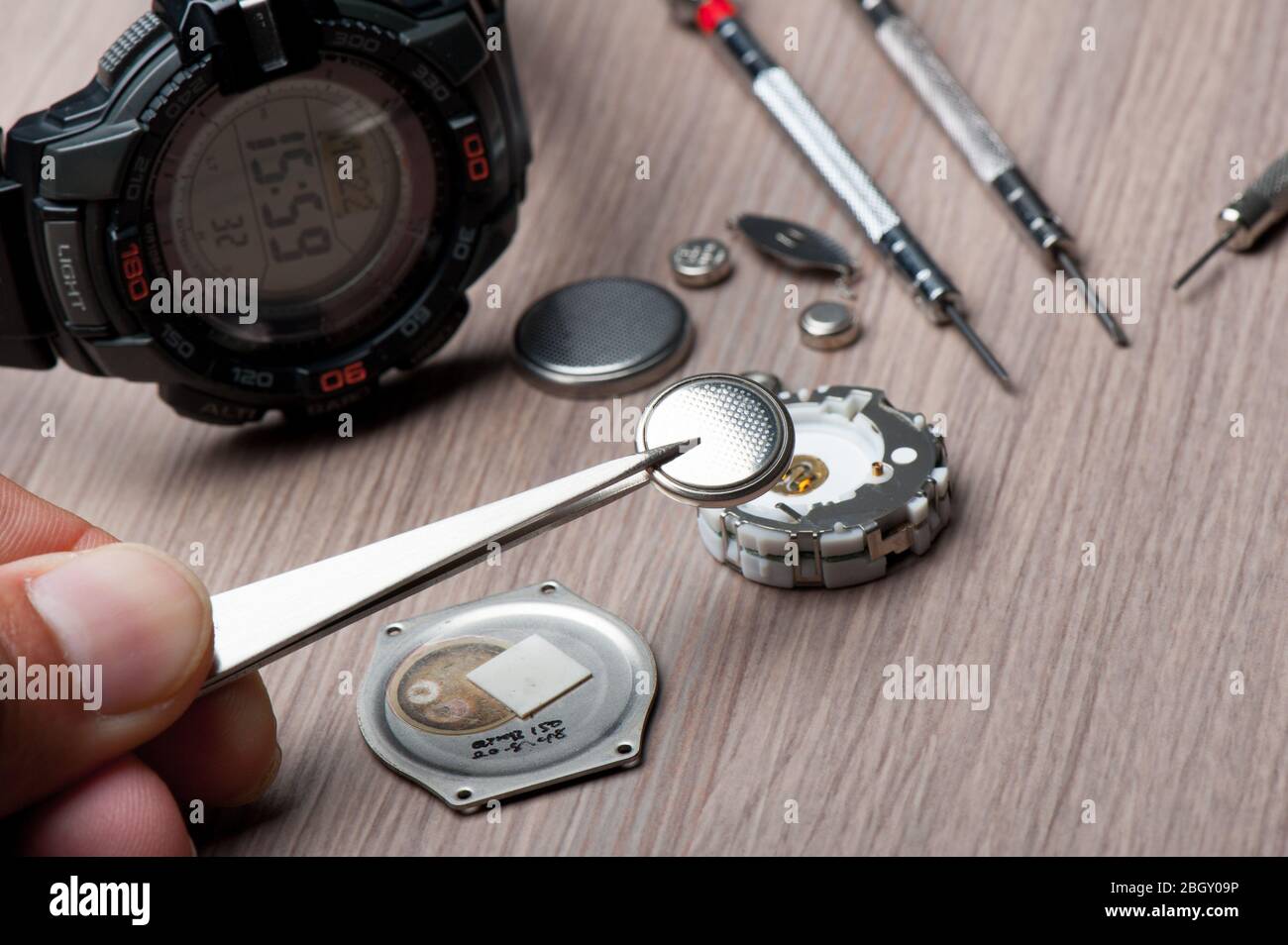 watch battery replacement, watchmaker replacing watch battery on quartz watch Stock Photo Alamy