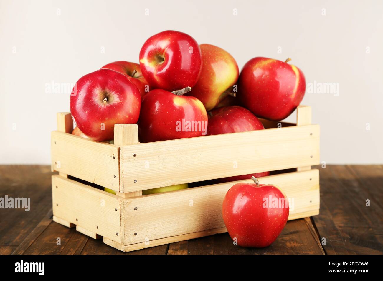 Crate Of Apples On Wooden Table On White Background Stock Photo Alamy