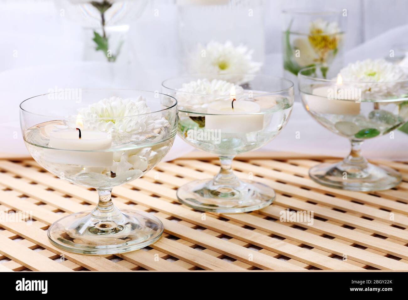 Floating candles in glass vases Stock Photo Alamy