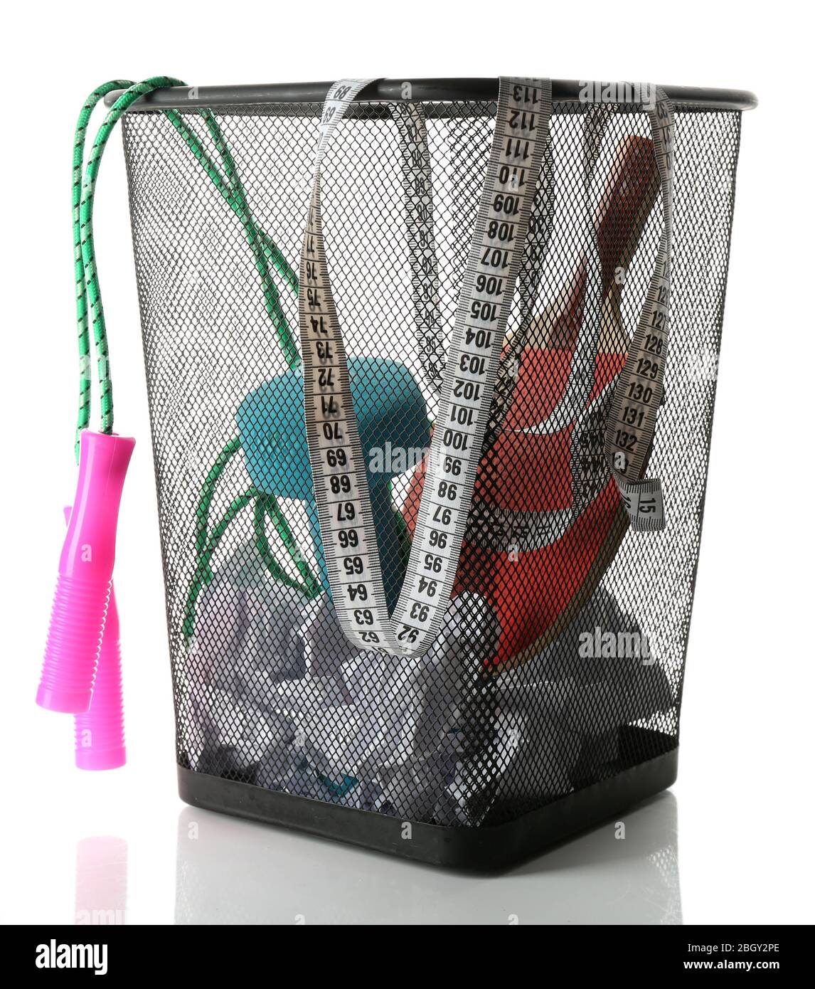 Metal trash bin with sport equipment, crumpled paper and weight scale
