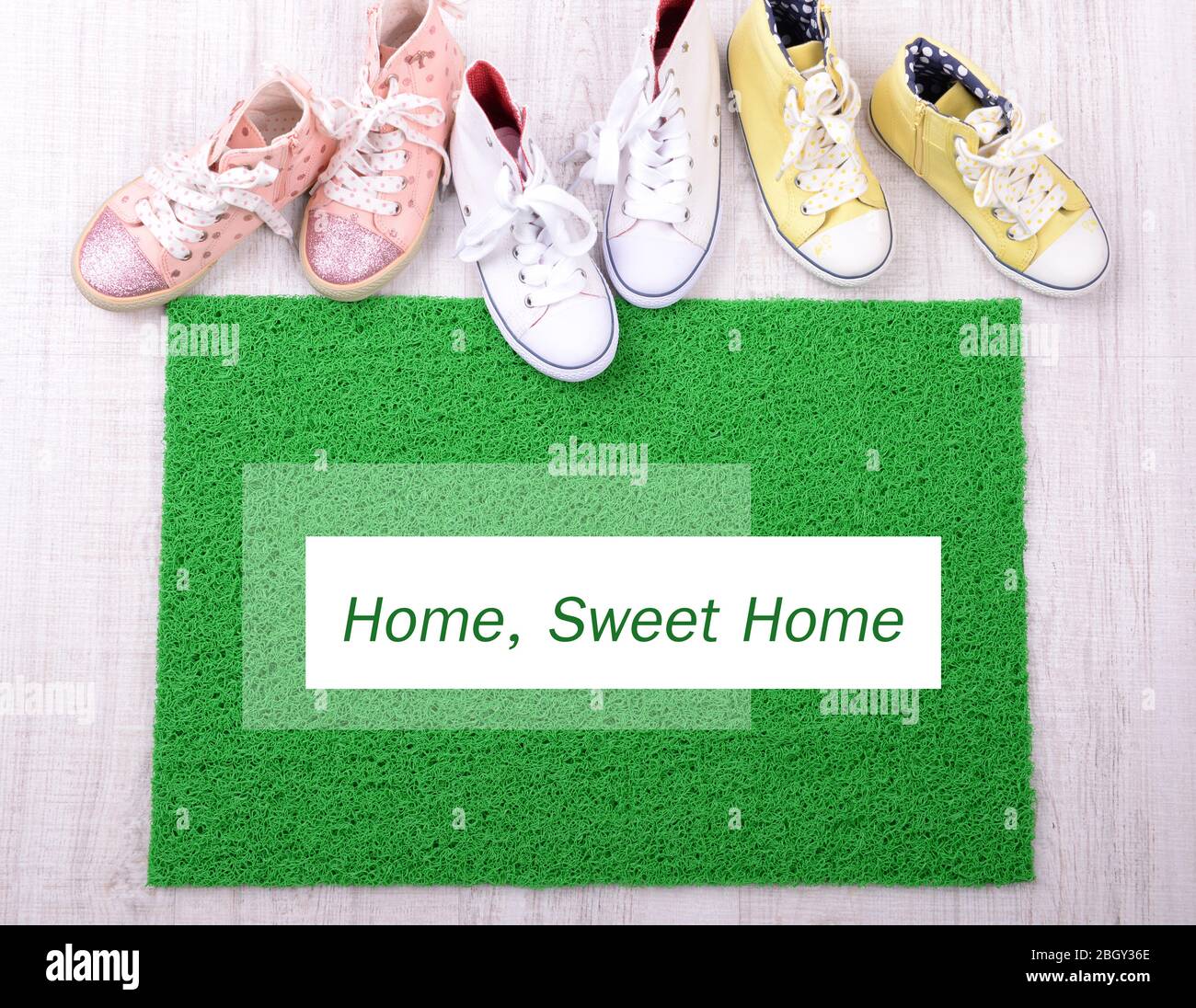 Green carpet on floor and converse close-up Stock Photo - Alamy