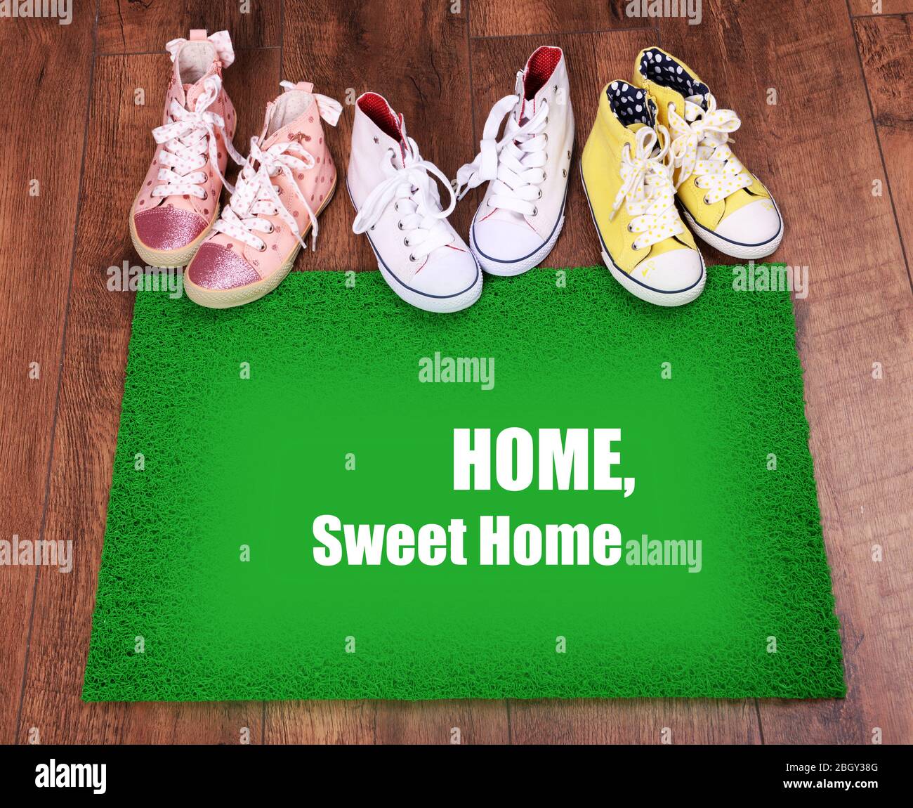 Green carpet on floor and converse close-up Stock Photo - Alamy