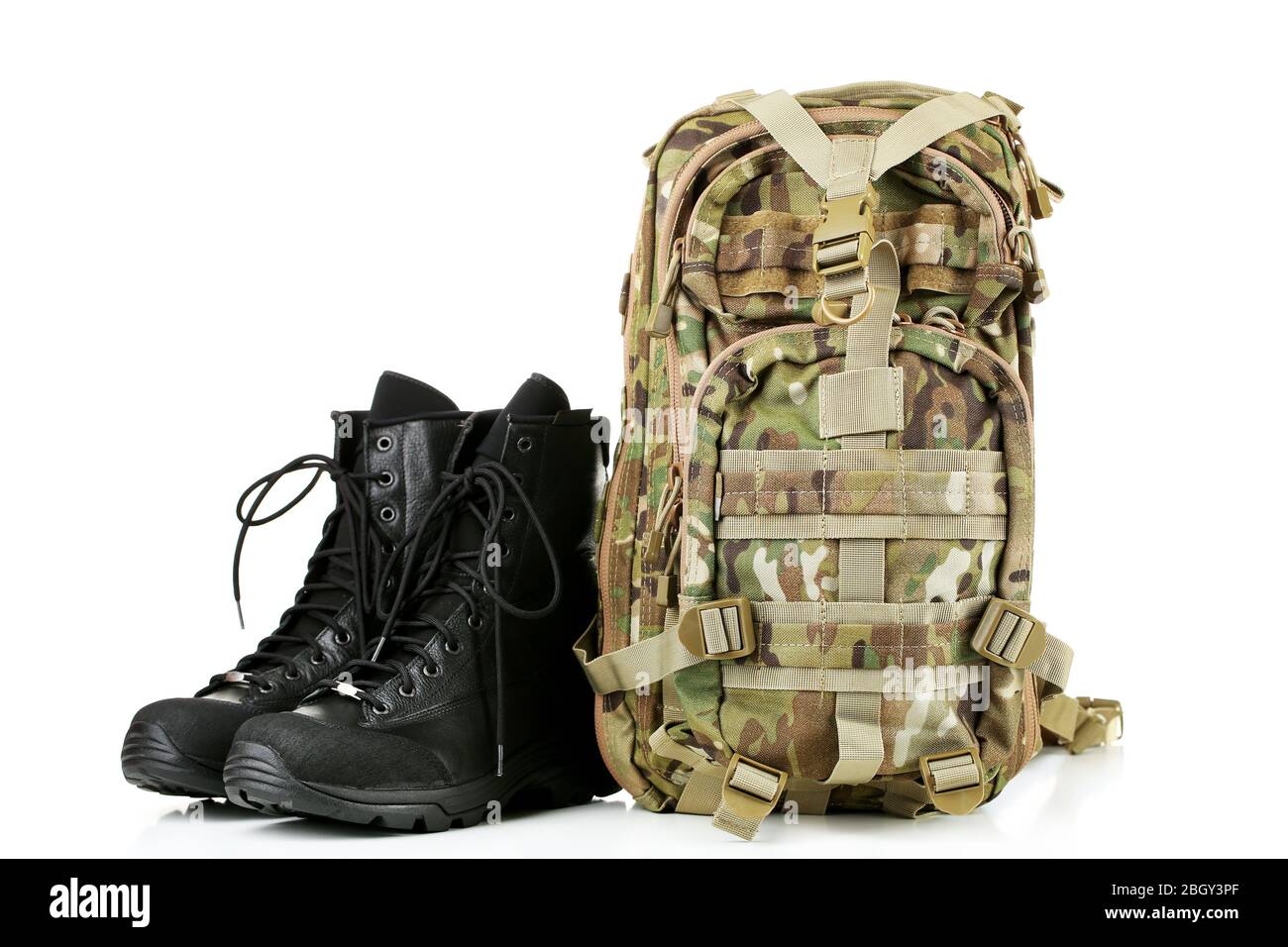 Black army boots and backpack, isolated 