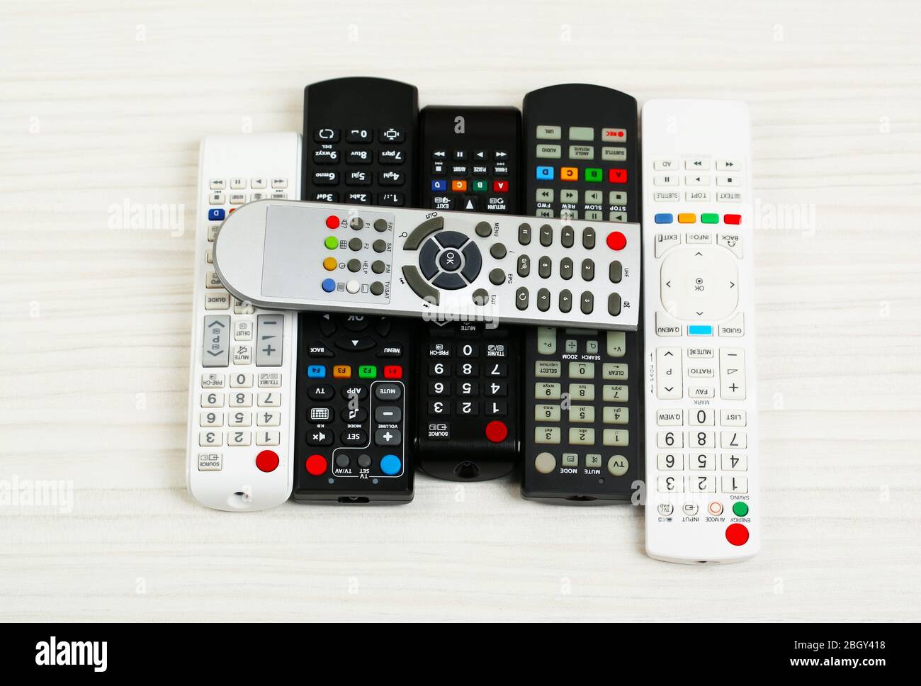 Many remote control devices on table Stock Photo