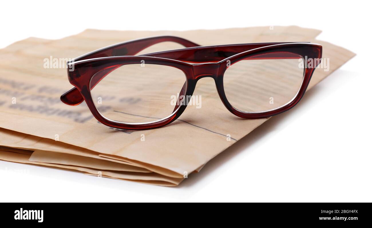 Glasses and newspapers, isolated on white Stock Photo