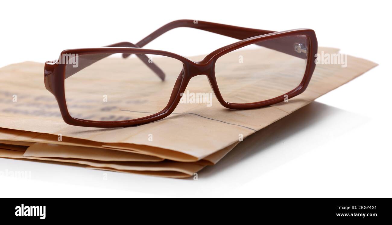 Glasses and newspapers, isolated on white Stock Photo