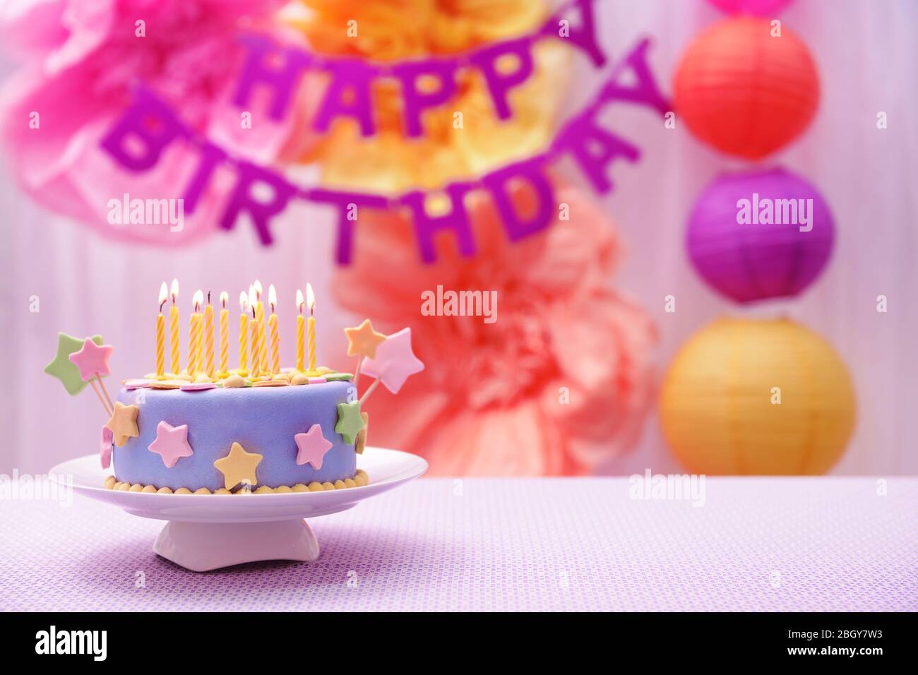 Delicious birthday cake on table on bright background Stock Photo - Alamy