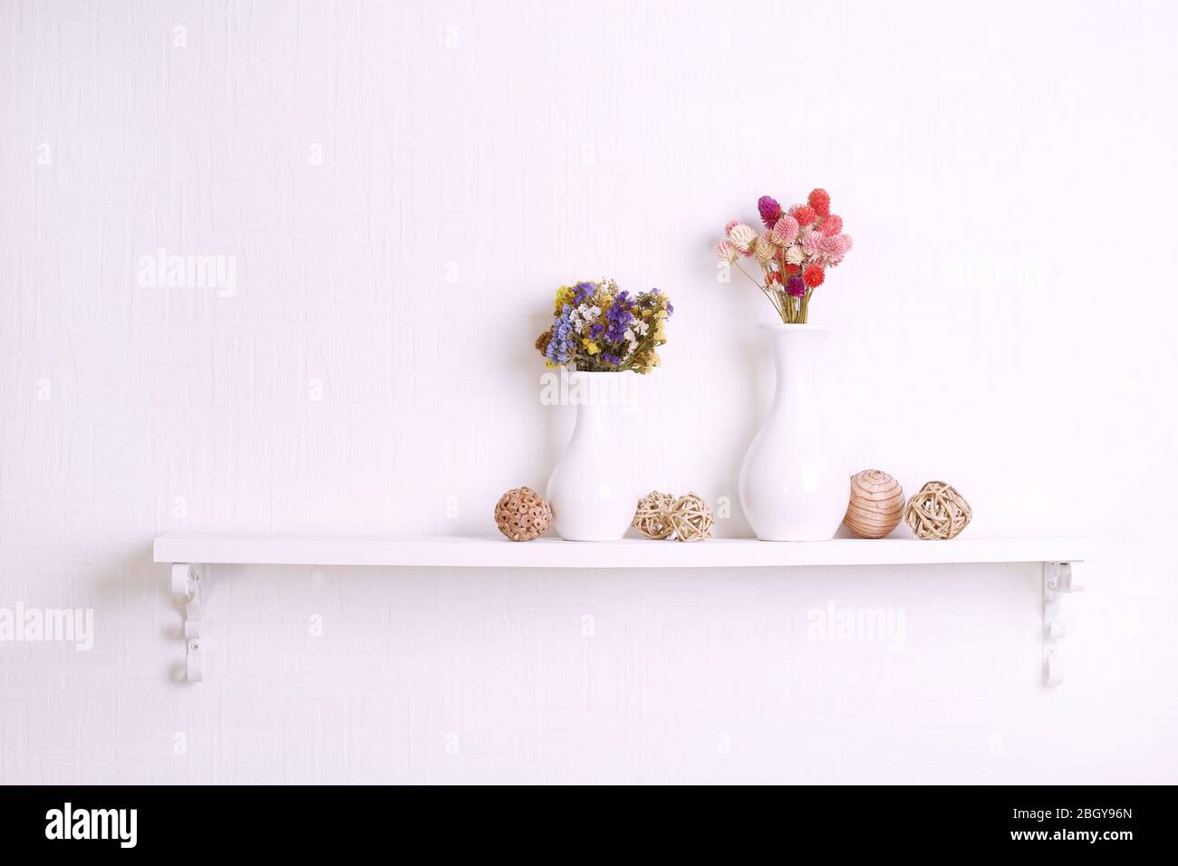 Composition of dried flowers on white wall background Stock Photo - Alamy