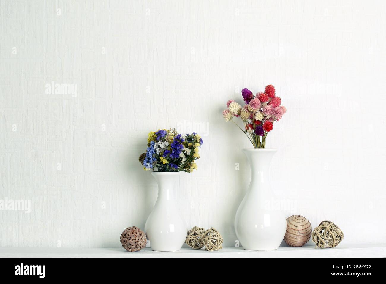 Composition of dried flowers on white wall background Stock Photo - Alamy