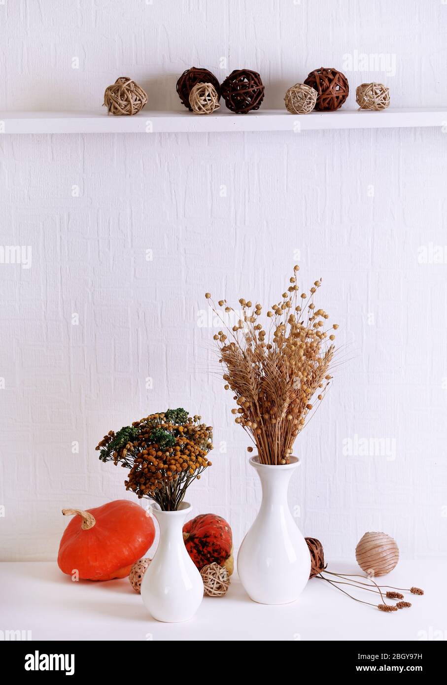 Composition of dried flowers on white wall background Stock Photo - Alamy