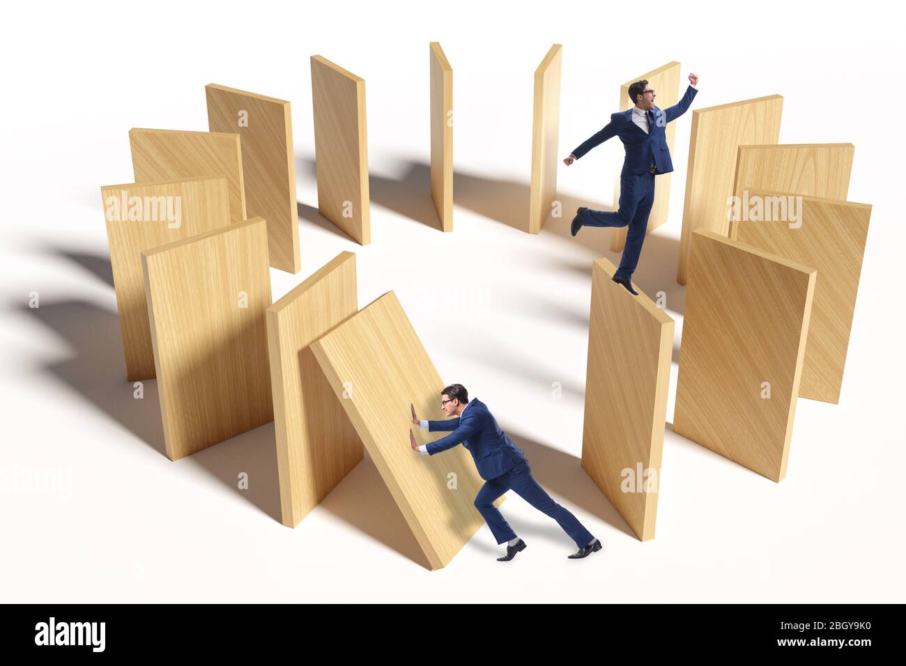 Domino effect and the competition concept Stock Photo - Alamy