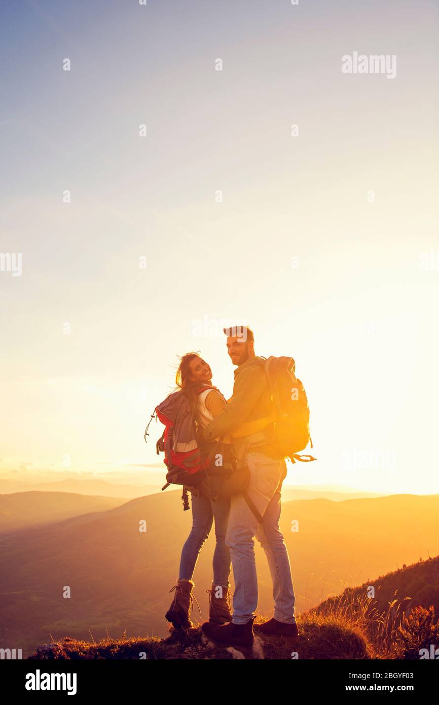 Man Standing On Top Of Mountain With Arms Raised High Resolution Stock Photography And Images