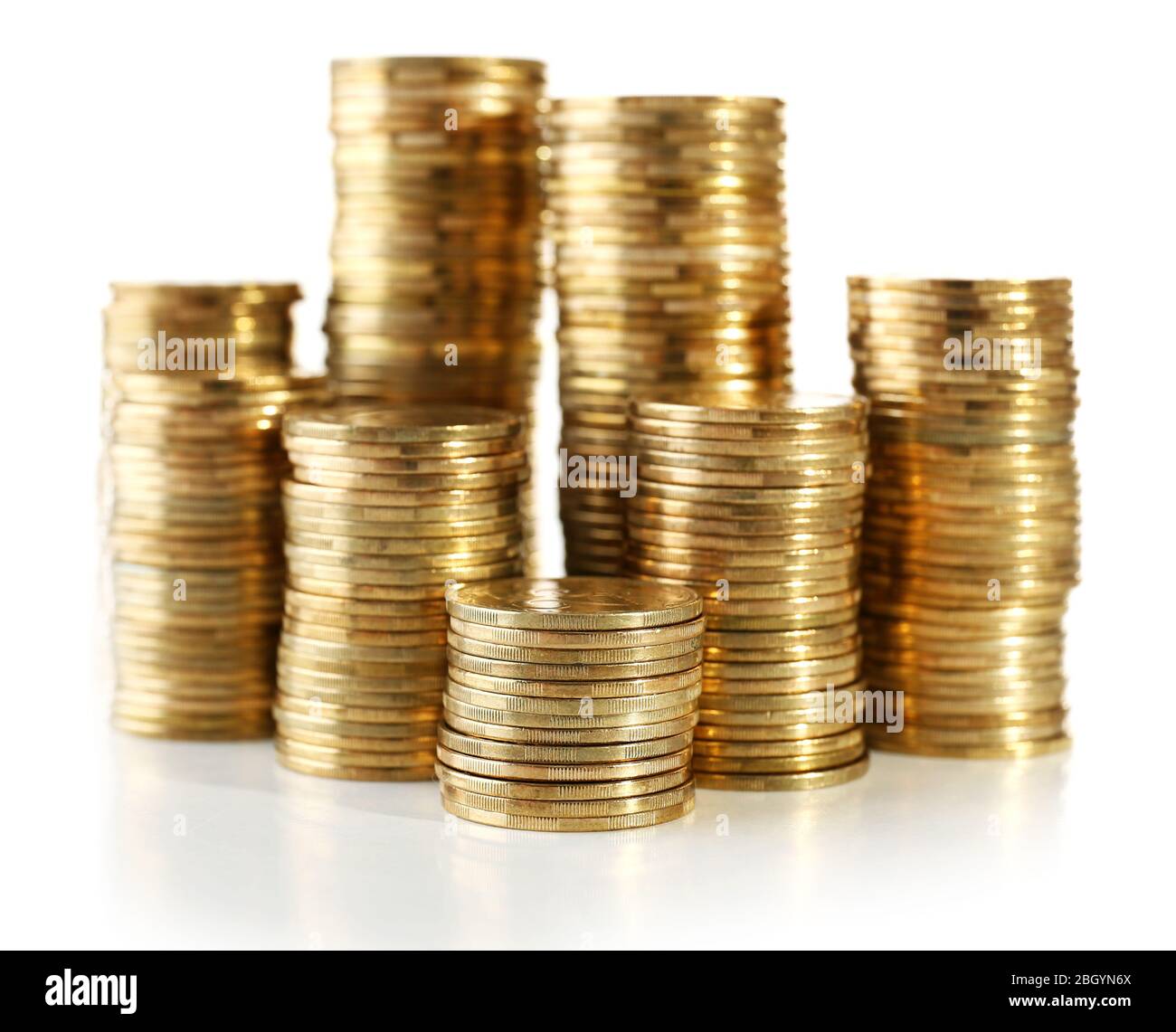 Pile of coins isolated on white Stock Photo - Alamy