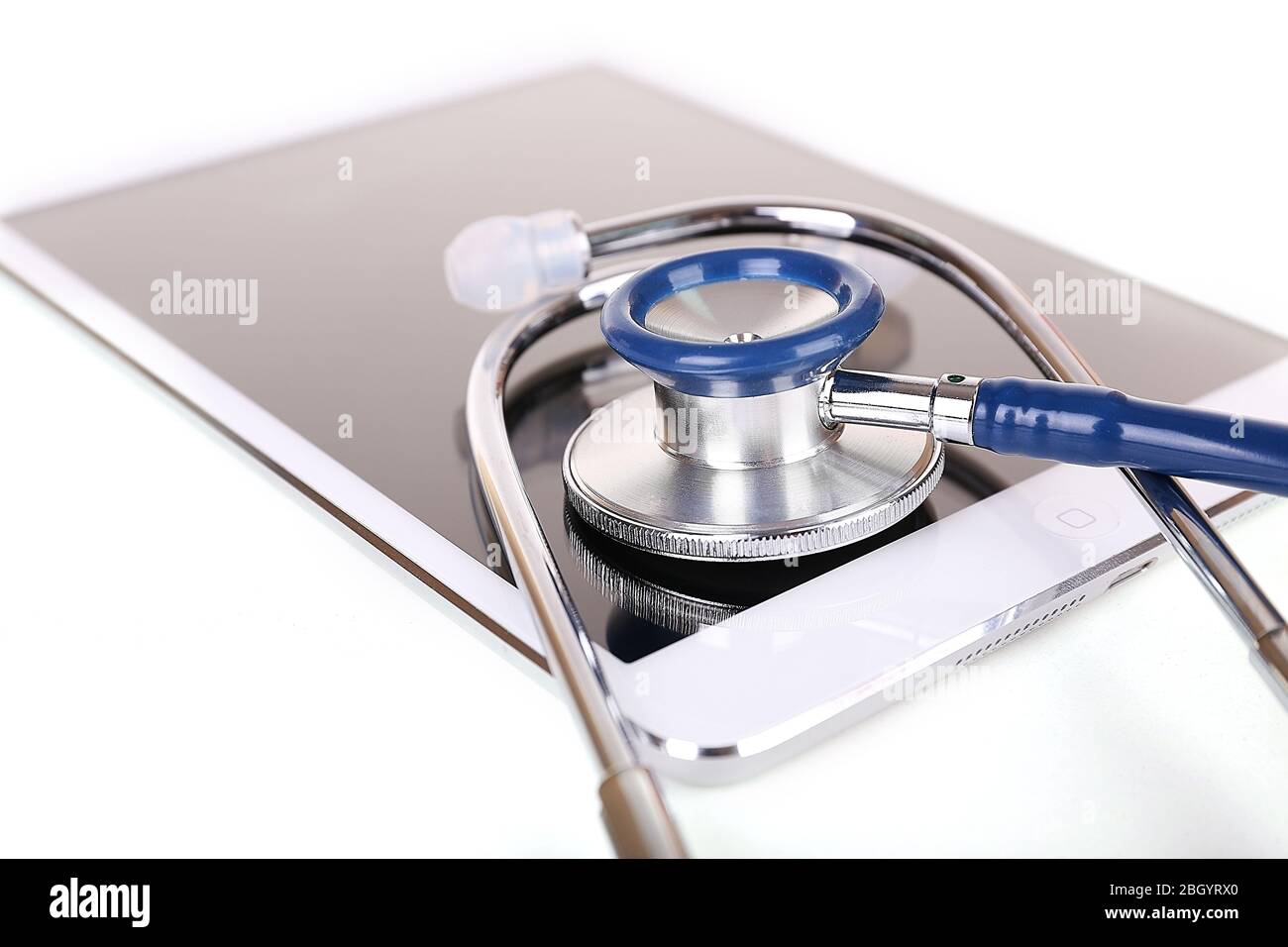 Tablet and blue stethoscope isolated on white Stock Photo - Alamy