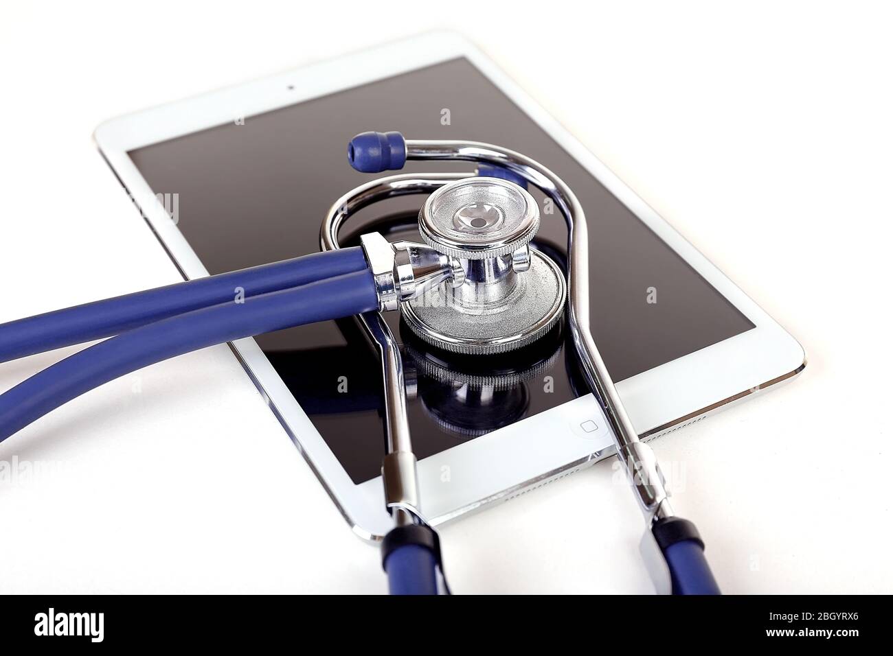 Tablet and blue stethoscope isolated on white Stock Photo - Alamy