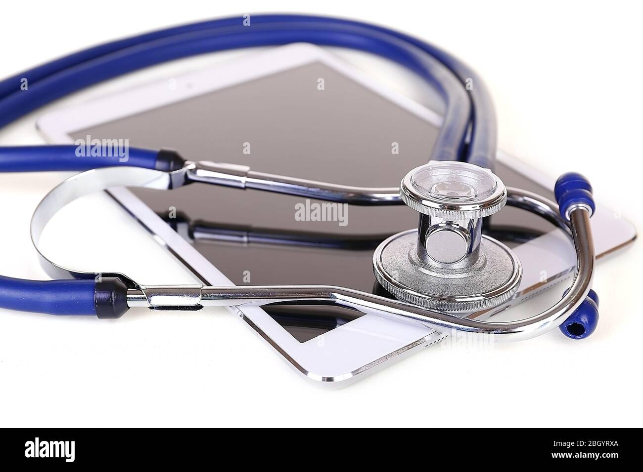 Tablet and blue stethoscope isolated on white Stock Photo - Alamy