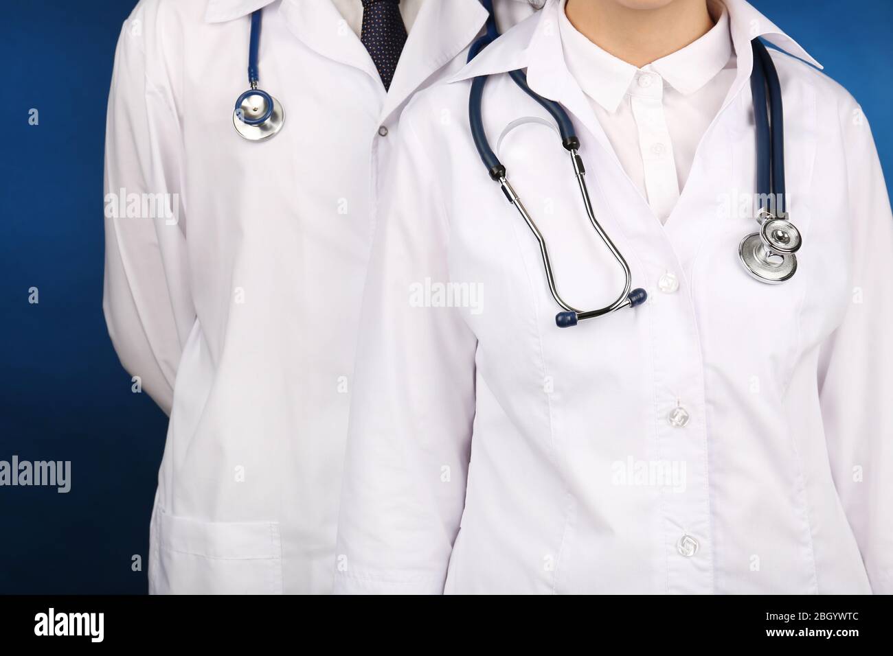 Two female doctors giving hi-res stock photography and images - Alamy