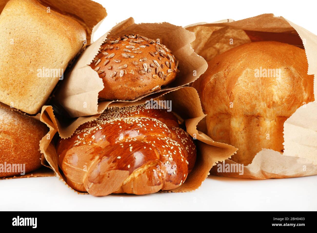 Fresh bread in paper bags on white background Stock Photo - Alamy