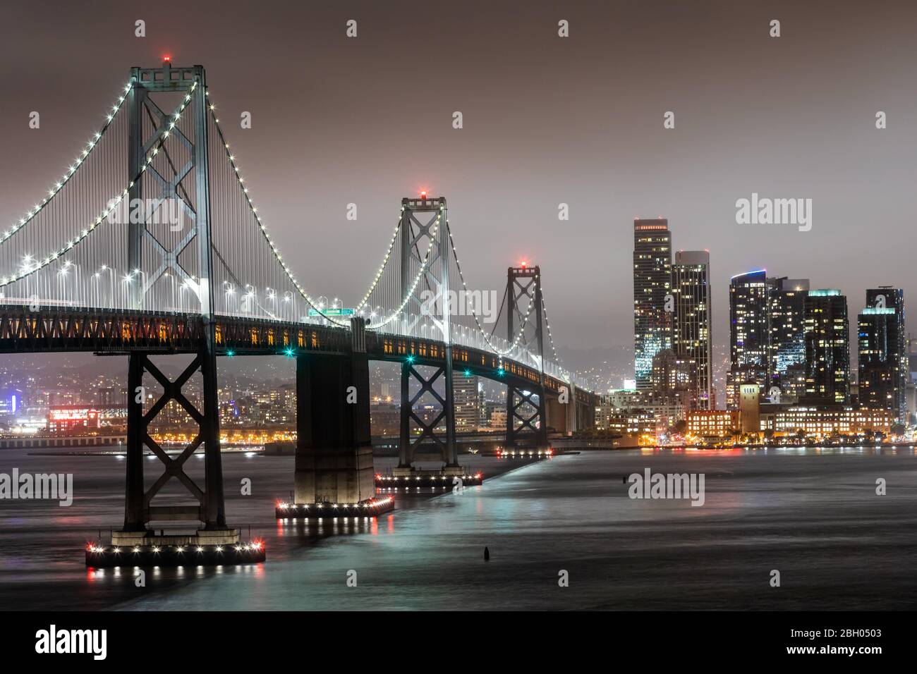 Night shot of the Bay Bridge and of the San Francisco skyline Stock Photo