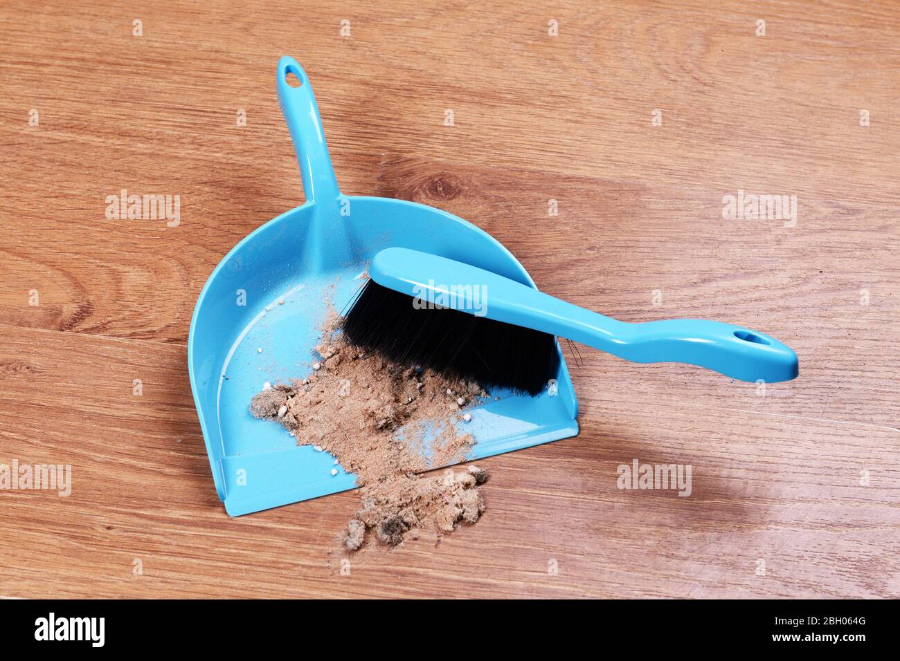 Trash in scoop on floor closeup Stock Photo Alamy