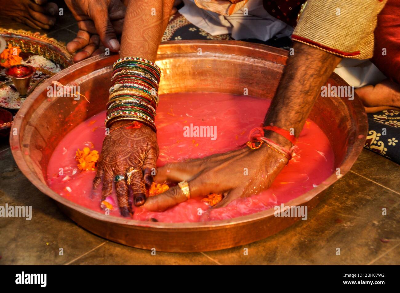 Indian wedding traditional game searching for ring in Plate, Indian marriage traditions Stock Photo