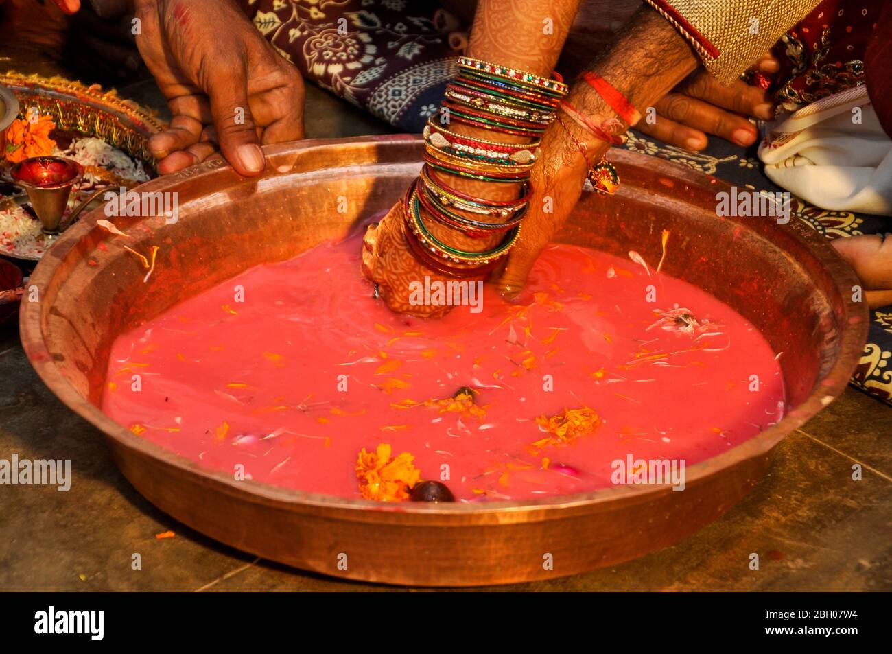 Indian wedding traditional game searching for ring in milk Plate, Indian marriage traditions Stock Photo
