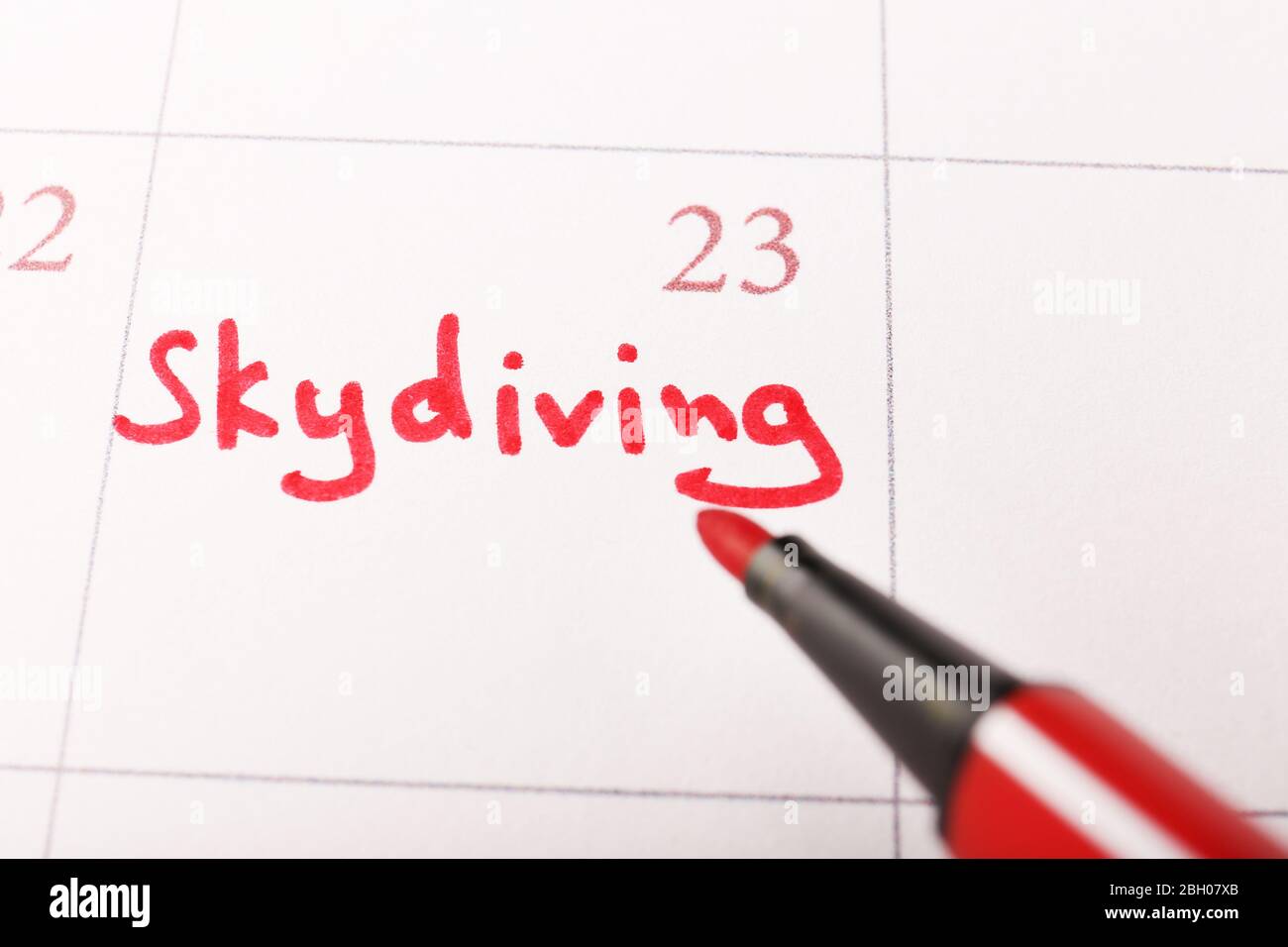 Written plan Skydiving on calendar page background Stock Photo Alamy