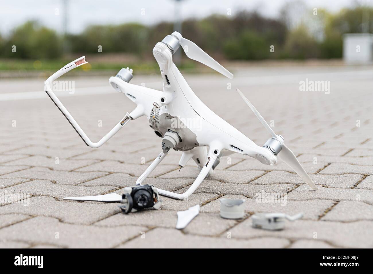 Crashed modern and camera after drone Stock Photo Alamy
