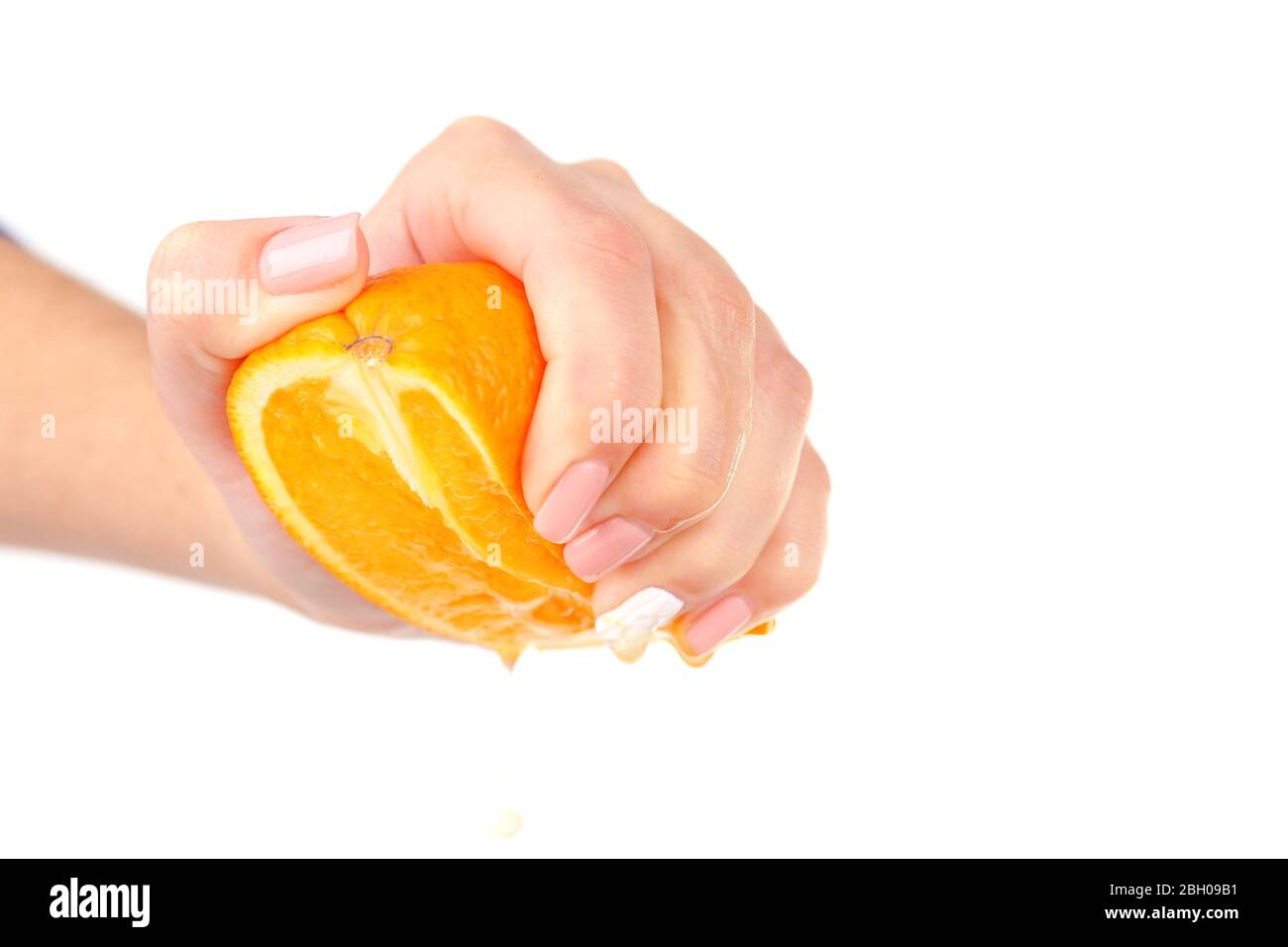Female hand squeezing orange isolated on white Stock Photo