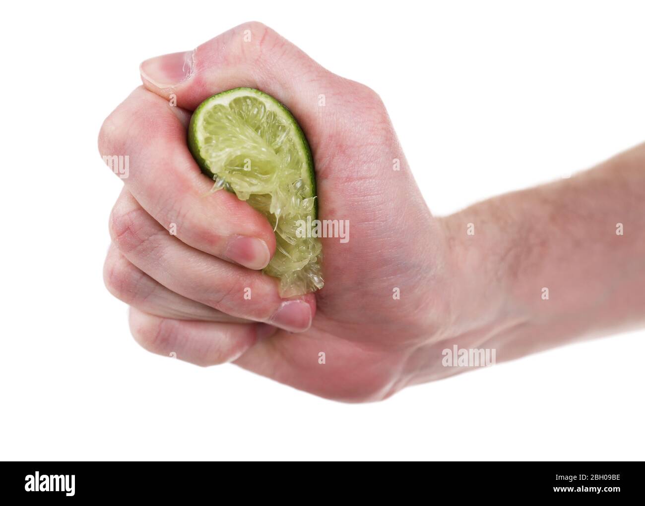 Female hand squeezing lime isolated on white Stock Photo