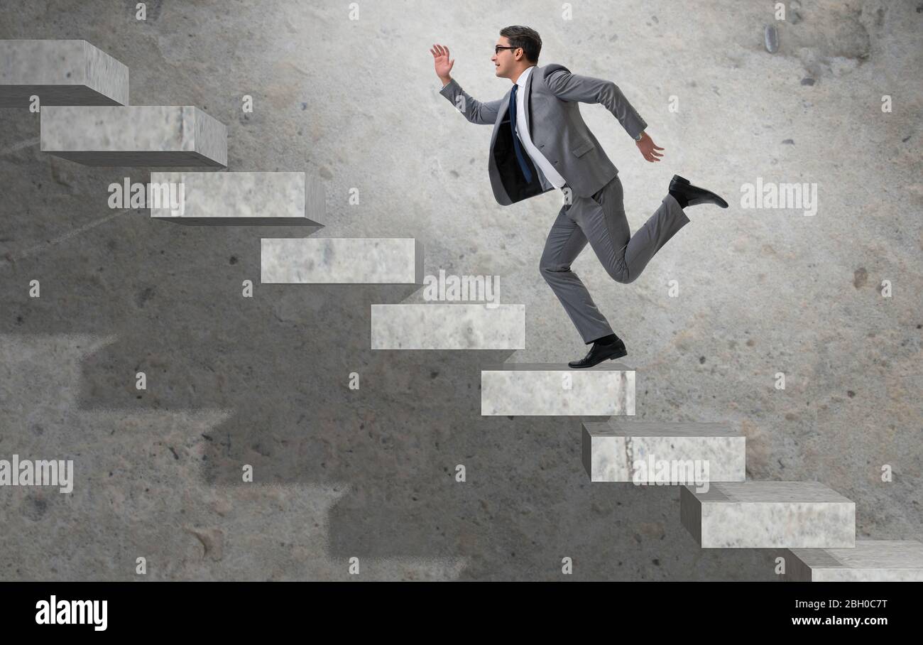 The young businessman climbing career ladder Stock Photo - Alamy