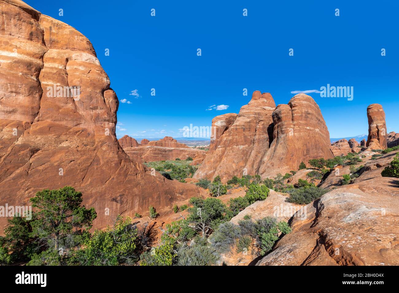 A lunar landscape showing a number of strange red sandstone formations in Devil's Garden trail, at Arches National Park Stock Photo
